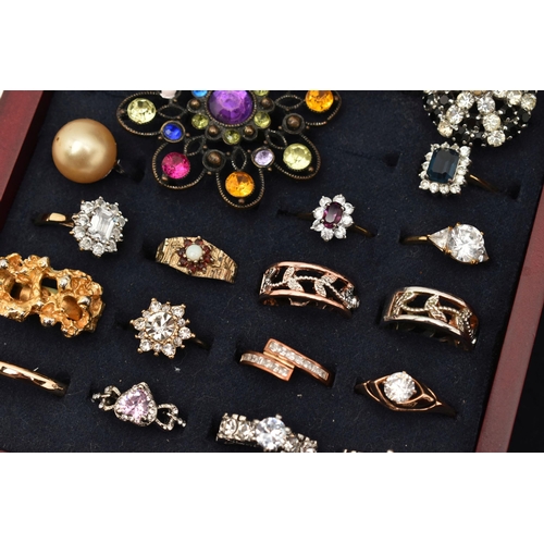 128 - A MULTI STORAGE WOODEN JEWELLERY BOX WITH COSTUME JEWELLERY, to include a variety of rings, cufflink... 