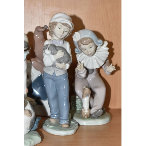 307 - A GROUP OF EIGHT NAO FIGURINES AND ONE LLADRO FIGURE to include a Lladro figure No. 5928 'Jazz Clari... 