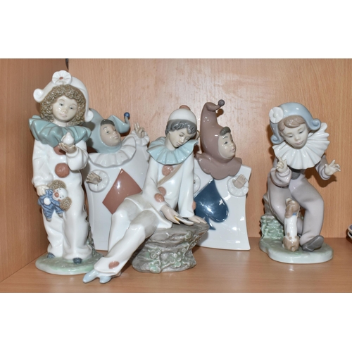 307 - A GROUP OF EIGHT NAO FIGURINES AND ONE LLADRO FIGURE to include a Lladro figure No. 5928 'Jazz Clari... 