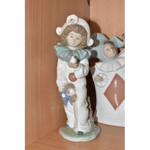 307 - A GROUP OF EIGHT NAO FIGURINES AND ONE LLADRO FIGURE to include a Lladro figure No. 5928 'Jazz Clari... 