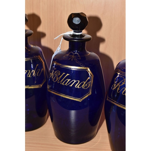 311 - A SET OF THREE EARLY 19TH CENTURY BRISTOL BLUE GLASS BARREL SHAPED DECANTERS, with original faceted ... 