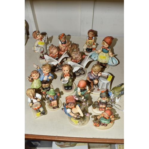 333 - A GROUP OF SIXTEEN HUMMEL FIGURES BY W. GOEBEL to include 'Wayside Harmony' 111 3/0 (marks on the ba... 