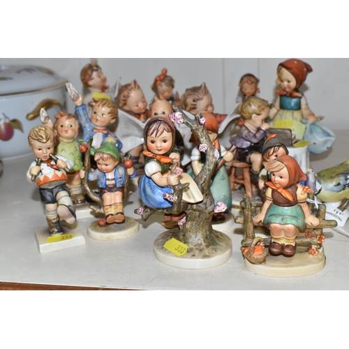 333 - A GROUP OF SIXTEEN HUMMEL FIGURES BY W. GOEBEL to include 'Wayside Harmony' 111 3/0 (marks on the ba... 