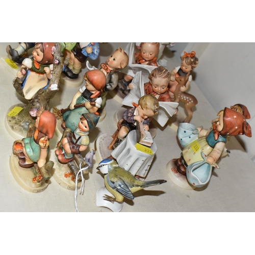 333 - A GROUP OF SIXTEEN HUMMEL FIGURES BY W. GOEBEL to include 'Wayside Harmony' 111 3/0 (marks on the ba... 