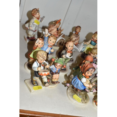 333 - A GROUP OF SIXTEEN HUMMEL FIGURES BY W. GOEBEL to include 'Wayside Harmony' 111 3/0 (marks on the ba... 