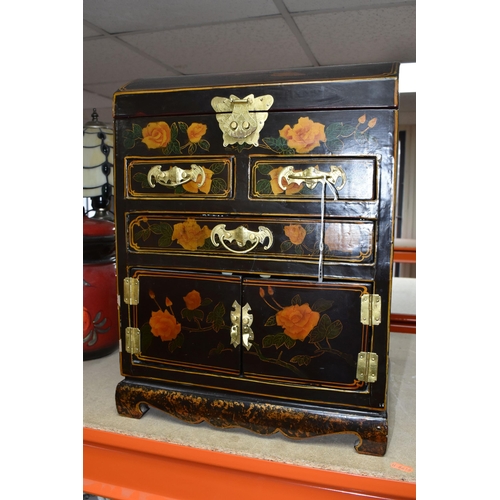 338 - A MODERN ORIENTAL STYLE CABINET, decorated with  transfer print peach coloured roses, a gilt metal b... 