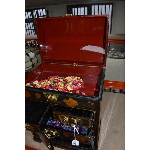 338 - A MODERN ORIENTAL STYLE CABINET, decorated with  transfer print peach coloured roses, a gilt metal b... 