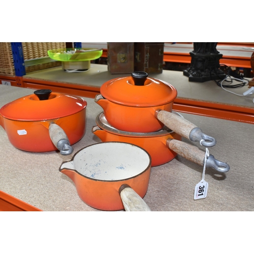 361 - FOUR LE CREUSET CAST IRON SAUCEPANS, in orange enamel with pouring lips and wooden handles, diameter... 