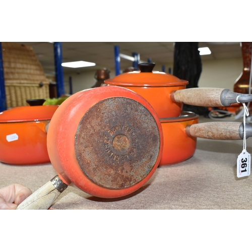 361 - FOUR LE CREUSET CAST IRON SAUCEPANS, in orange enamel with pouring lips and wooden handles, diameter... 