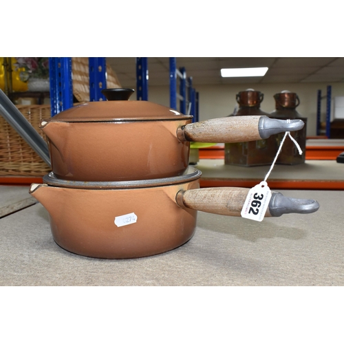 362 - TWO LE CREUSET CAST IRON SAUCEPANS, in brown enamel, with pouring lips and wooden handles, diameters... 