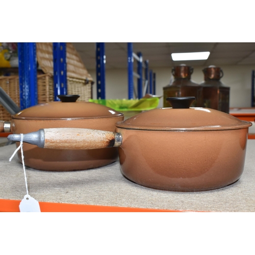 362 - TWO LE CREUSET CAST IRON SAUCEPANS, in brown enamel, with pouring lips and wooden handles, diameters... 