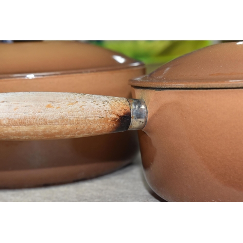 362 - TWO LE CREUSET CAST IRON SAUCEPANS, in brown enamel, with pouring lips and wooden handles, diameters... 