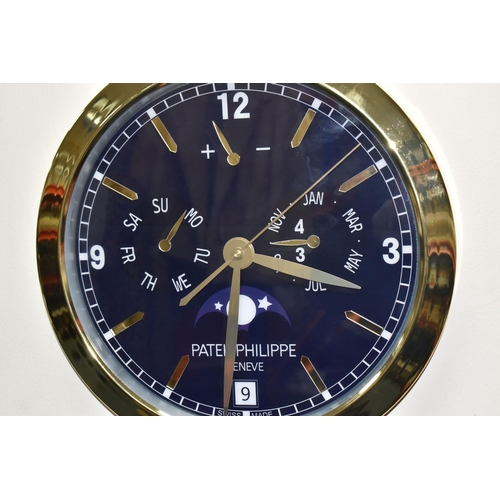 391 - A PATEK PHILIPPE GENEVE DISPLAY CLOCK with printed Arabic numeral timestamps on a blue white face an... 