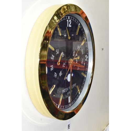 391 - A PATEK PHILIPPE GENEVE DISPLAY CLOCK with printed Arabic numeral timestamps on a blue white face an... 