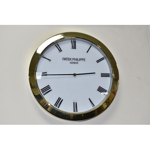 392 - A PATEK PHILIPPE GENEVE DISPLAY CLOCK with printed Roman numeral timestamps on a plain white face an... 