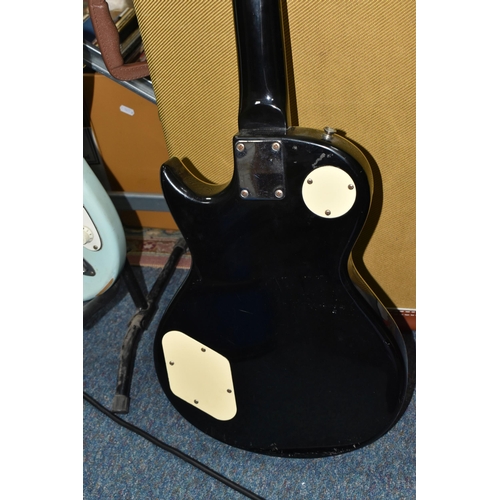 407 - TWO 'VINTAGE' MARKED ELECTRIC GUITARS to include a black bodied electric guitar branded 'Vintage' to... 