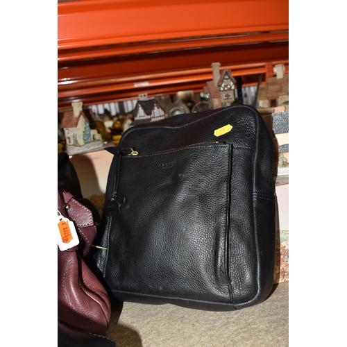 415 - FOUR RADLEY HANDBAGS, comprising a black satchel style, with green and grey square lining magnet fas... 