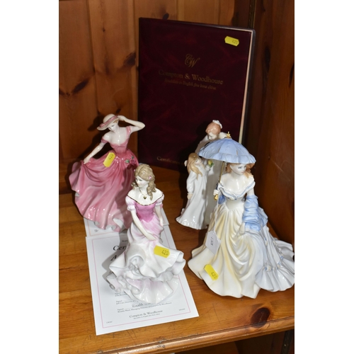 428 - A GROUP OF FOUR PORCELAIN FIGURINES to include two Royal Doulton 'Compton and Woodhouse figurines co... 