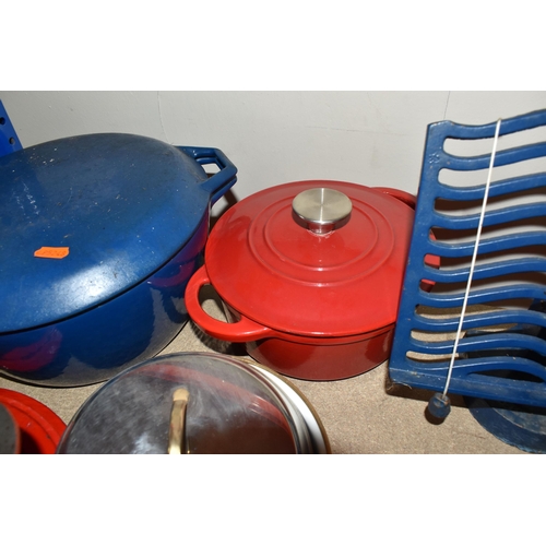 441 - A LARGE GROUP OF MOSTLY CAST IRON KITCHENWARE comprising two book stands, a pan stand, a set of cast... 