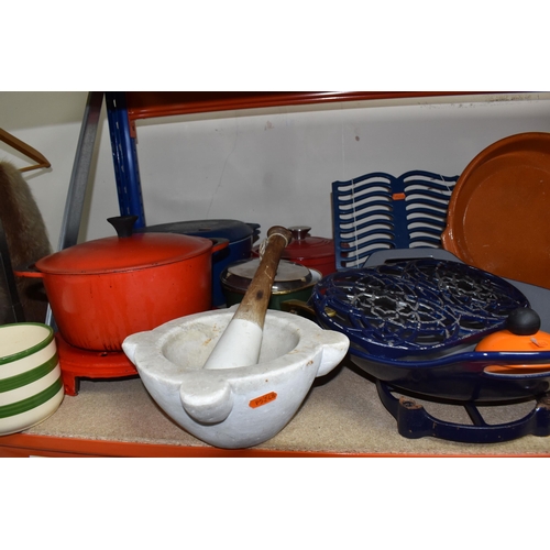 441 - A LARGE GROUP OF MOSTLY CAST IRON KITCHENWARE comprising two book stands, a pan stand, a set of cast... 