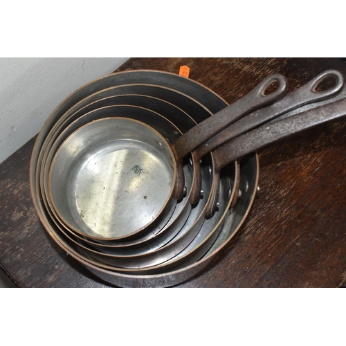 459 - FIVE FRENCH COPPER PANS, of graduating sizes, approximate measurements: smallest diameter 12cm x hei... 