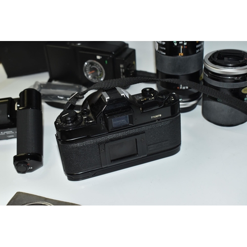 467 - A BOX OF PHOTOGRAPHIC EQUIPMENT, to include a Canon A-1 camera fitted with a Canon f2.8 28mm lens, w... 