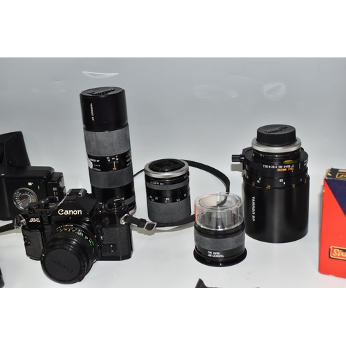 467 - A BOX OF PHOTOGRAPHIC EQUIPMENT, to include a Canon A-1 camera fitted with a Canon f2.8 28mm lens, w... 