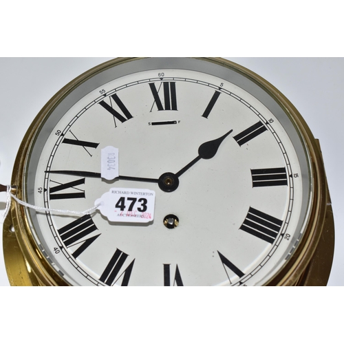 473 - A SMITHS BRASS CASED BULKHEAD CLOCK, the face marked with black Roman numerals, labelled verso 'Smit... 