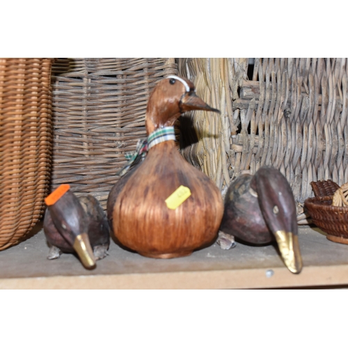 482 - A GROUP OF WICKER BASKETS AND WOODEN ORNAMENTS to include a group of six decorative ducks in assorte... 