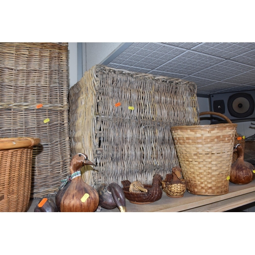 482 - A GROUP OF WICKER BASKETS AND WOODEN ORNAMENTS to include a group of six decorative ducks in assorte... 