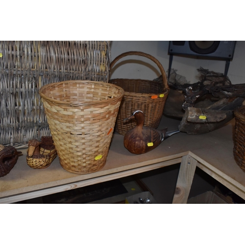 482 - A GROUP OF WICKER BASKETS AND WOODEN ORNAMENTS to include a group of six decorative ducks in assorte... 