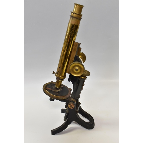 501 - A J. SWIFT & SON EARLY TWENTIETH CENTURY MICROSCOPE, the base stamped with the London maker's name, ... 