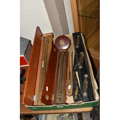 502 - A BOX OF TECHNICAL DRAWING EQUIPMENT, comprising two cased brass parallel rolling rules, four parall... 