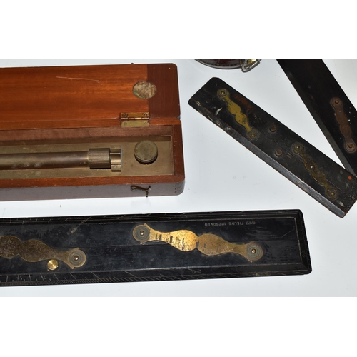 502 - A BOX OF TECHNICAL DRAWING EQUIPMENT, comprising two cased brass parallel rolling rules, four parall... 