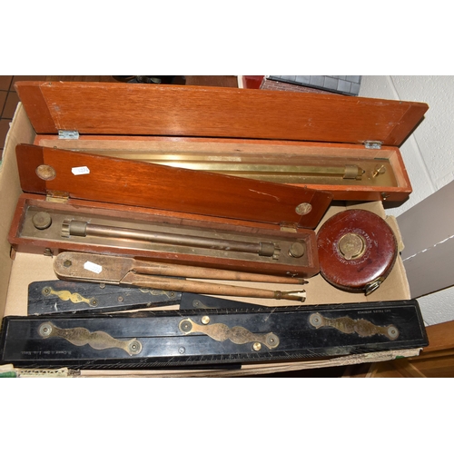 502 - A BOX OF TECHNICAL DRAWING EQUIPMENT, comprising two cased brass parallel rolling rules, four parall... 