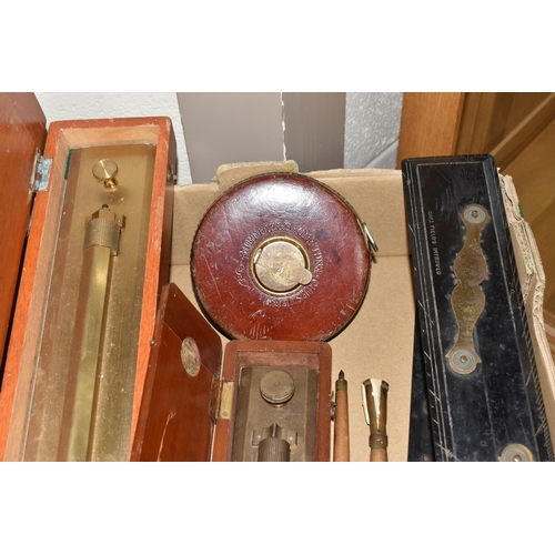 502 - A BOX OF TECHNICAL DRAWING EQUIPMENT, comprising two cased brass parallel rolling rules, four parall... 