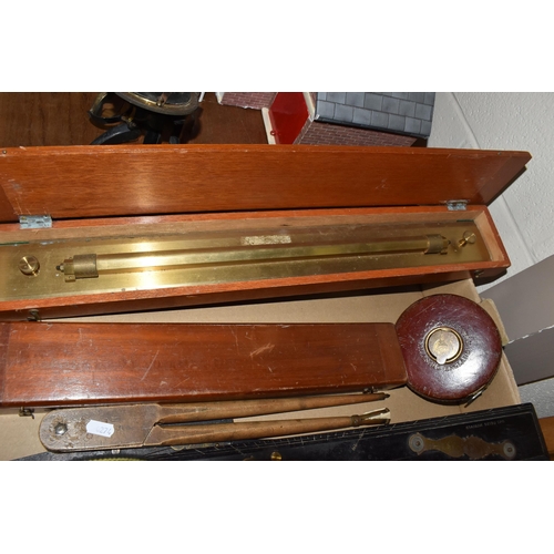 502 - A BOX OF TECHNICAL DRAWING EQUIPMENT, comprising two cased brass parallel rolling rules, four parall... 