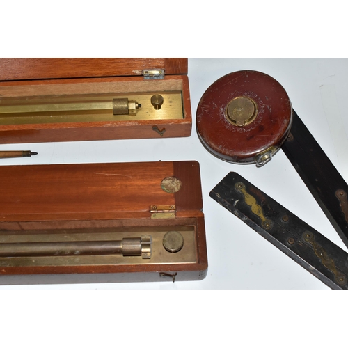 502 - A BOX OF TECHNICAL DRAWING EQUIPMENT, comprising two cased brass parallel rolling rules, four parall... 