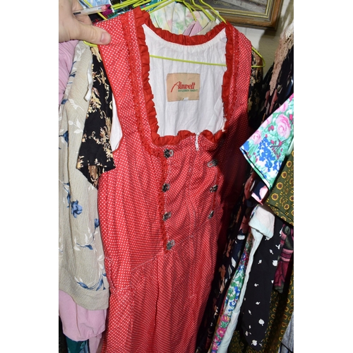 517 - A QUANTITY OF MODERN AND VINTAGE LADIES' CLOTHING, to include coats, dresses and blouses, brands  An... 