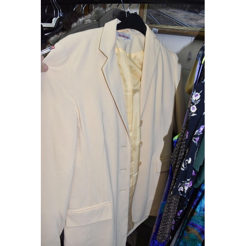 517 - A QUANTITY OF MODERN AND VINTAGE LADIES' CLOTHING, to include coats, dresses and blouses, brands  An... 