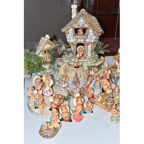 531 - A COLLECTION OF PENDELFIN RABBIT FIGURES, COTTAGES AND STANDS, comprising figures: Blossom in turquo... 