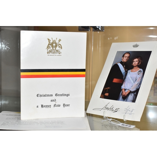 544 - A CHRISTMAS CARD FROM UGANDAN DICTATOR IDI AMIN, A SIGNED PHOTO OF THE FORMER SPANISH KING, AND A HU... 