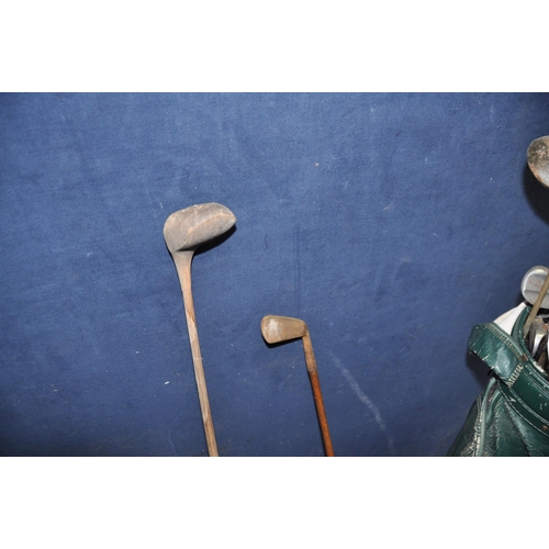 1062 - A VINTAGE GOLF BAG , ELECTRIC TROLLEY AND CLUBS including a hickory shafted 'Mashie' and   wood, oth... 