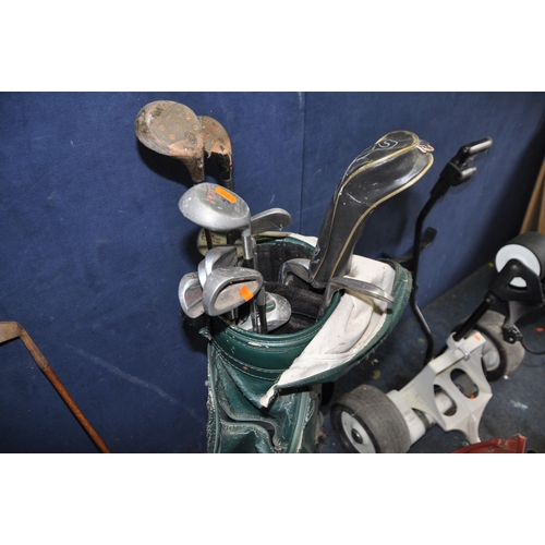 1062 - A VINTAGE GOLF BAG , ELECTRIC TROLLEY AND CLUBS including a hickory shafted 'Mashie' and   wood, oth... 