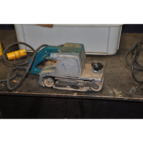 1064 - A TRAY CONTAINING A 110V TRANSFORMER, a 4in belt sander (110v possibly an old Makita) and a Sealey a... 