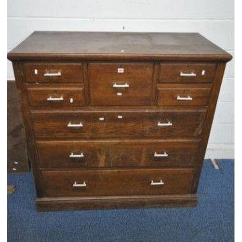 1200 - A 20TH CENTURY OAK SCOTTISH CHEST, with a deep drawer, flanked by two pairs of small drawers, above ... 