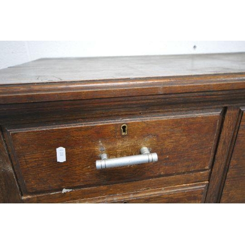 1200 - A 20TH CENTURY OAK SCOTTISH CHEST, with a deep drawer, flanked by two pairs of small drawers, above ... 