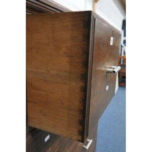 1200 - A 20TH CENTURY OAK SCOTTISH CHEST, with a deep drawer, flanked by two pairs of small drawers, above ... 