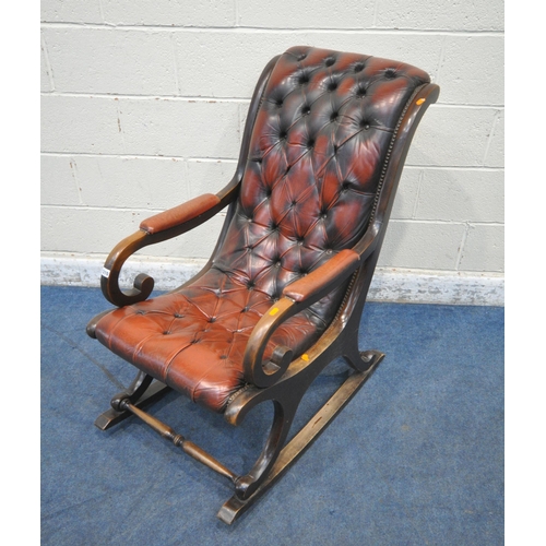 1210 - AN OXBLOOD BUTTONED LEATHER CHESTERFIELD STYLE SLIPPER ROCKING CHAIR, with open armrests, width 59cm... 