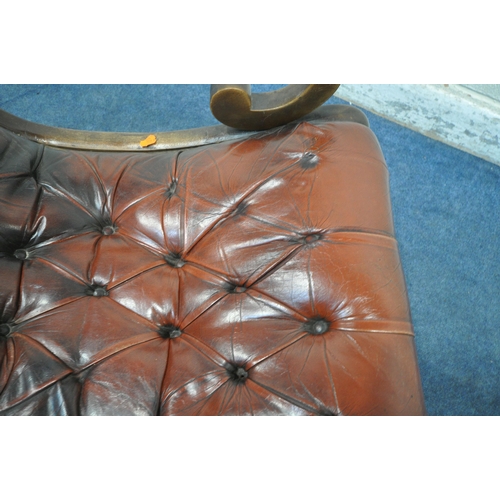 1210 - AN OXBLOOD BUTTONED LEATHER CHESTERFIELD STYLE SLIPPER ROCKING CHAIR, with open armrests, width 59cm... 